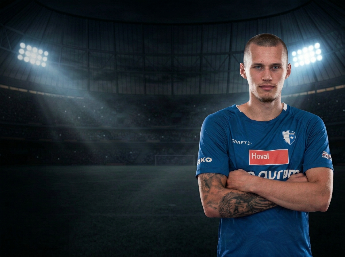 Martins Meiers in his club kit inside a floodlit stadium